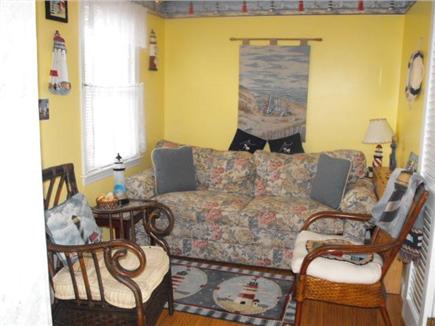 Dennisport Cape Cod vacation rental - Comfortable couch in Living room and two rattan chairs.