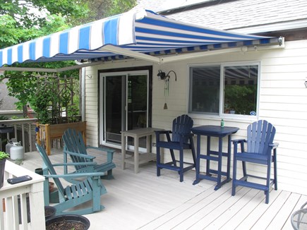 South Orleans Cape Cod vacation rental - Upper deck seating, grill, awning, views of gardens, pond