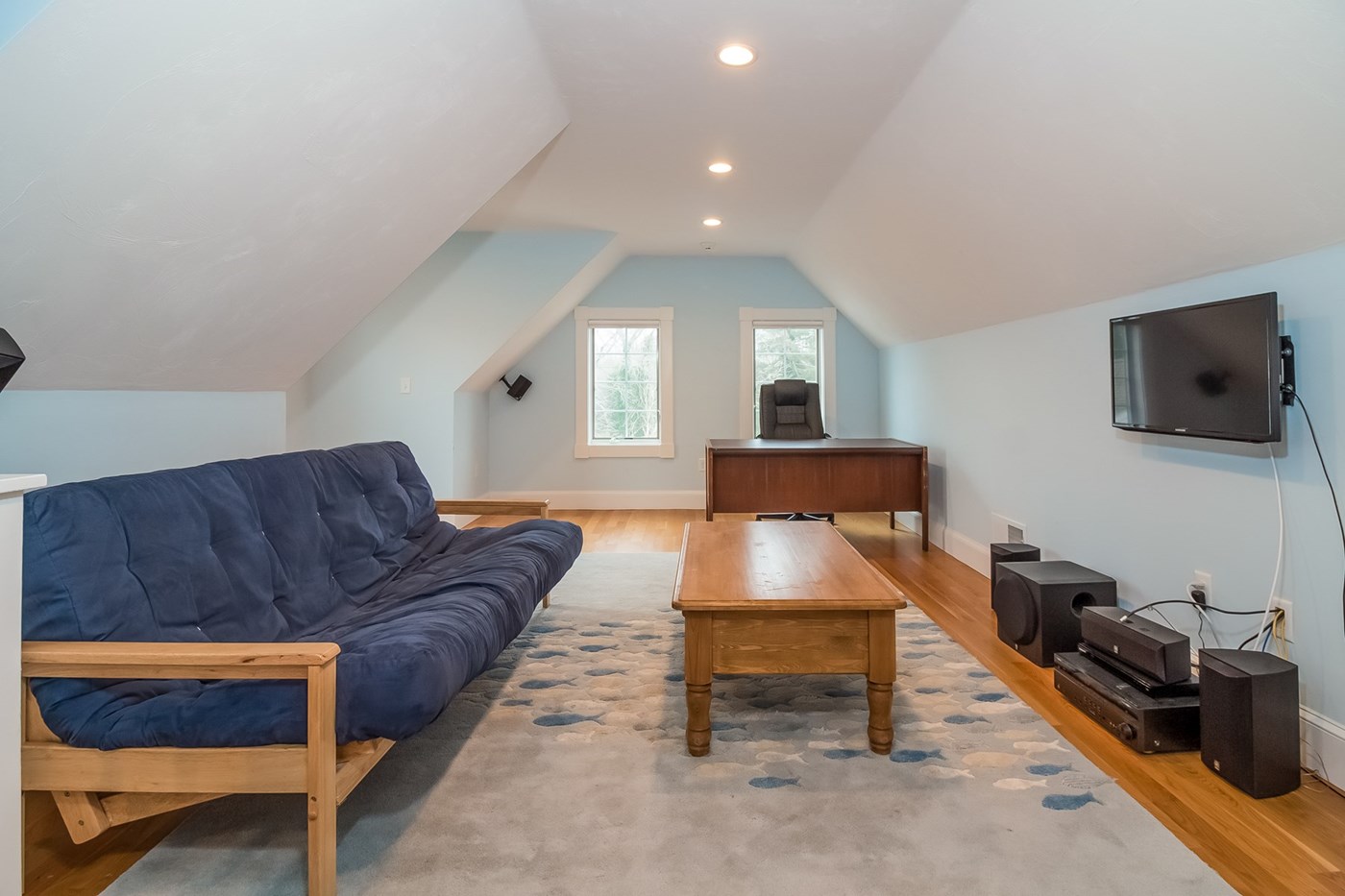 Above garage suite with bedroom, living area, & bath.