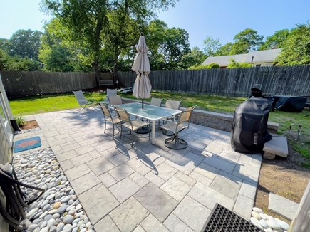 Dennis Cape Cod vacation rental - Large patio, gas grill, firepit, outdoor shower & rockers