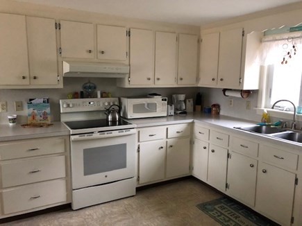 South Yarmouth Cape Cod vacation rental - Well-stocked kitchen with dishwasher, fridge, stove, & microwave.