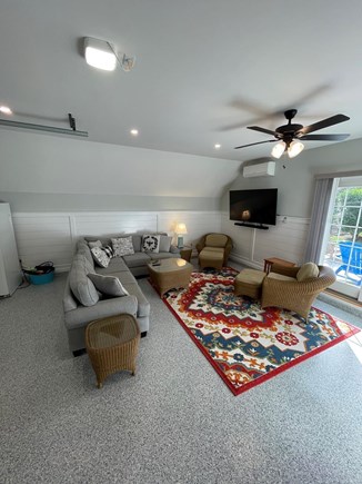 Brewster Cape Cod vacation rental - Garage/bonus room with 65” Smart TV and comfortable sectional