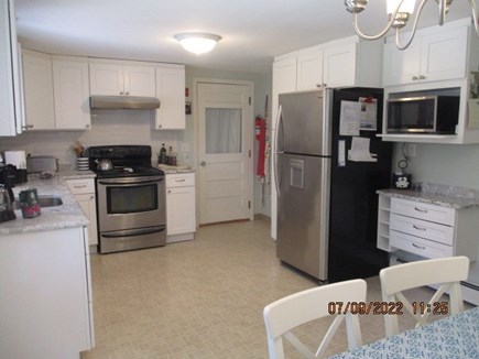 Hyannis/Craigville Cape Cod vacation rental - Kitchen view, connects to second family room w/ TV & sofa.