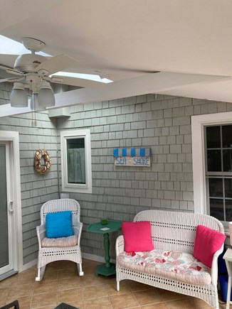 Dennis Cape Cod vacation rental - Sunroom with ceiling fan and sliding doors leading to backyard