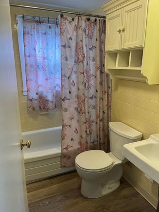 West dennis Cape Cod vacation rental - Bright full bathroom with shower and bathtub.