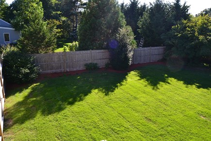 East Falmouth Cape Cod vacation rental - Large fenced-in yard, perfect for kids and 4-legged friends