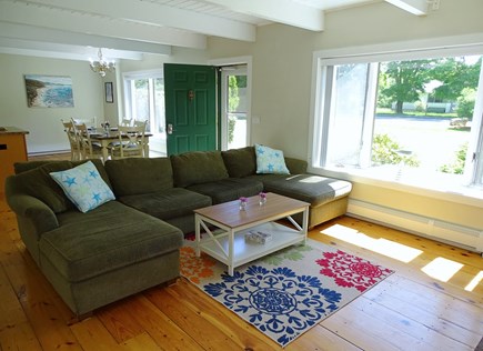 East Falmouth Cape Cod vacation rental - Bright living room with bay window, opens to dining