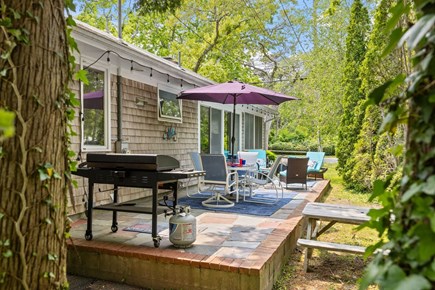 Harwich Port Cape Cod vacation rental - Set the table under the umbrella and dine surrounded by nature