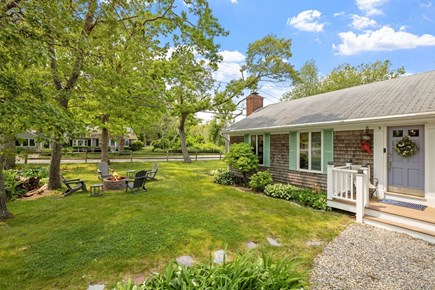 Harwich Port Cape Cod vacation rental - Catch up under the canopy of trees as the fire crackles