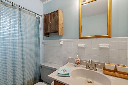 Harwich Port Cape Cod vacation rental - The hall bath offers a calming retreat with its soft blue tones