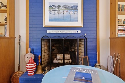 Harwich Port Cape Cod vacation rental - The heart of the living room—a bold blue brick fireplace