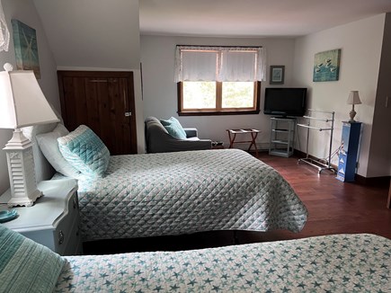 Chatham Cape Cod vacation rental - Bedroom 2 has a queen and a twin bed with a sitting area and TV.