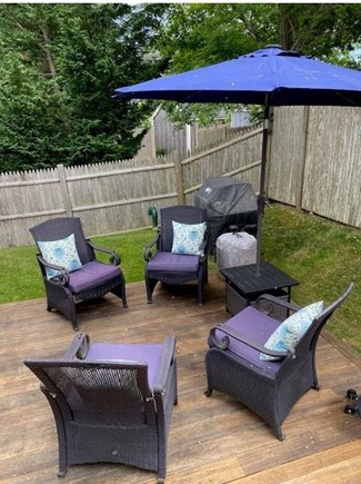 Dennisport Cape Cod vacation rental - Back deck seating area & grill