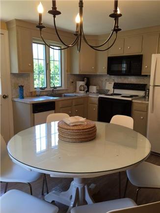 Harwichport Cape Cod vacation rental - Dining area in kitchen and back door