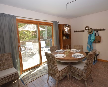 Truro Cape Cod vacation rental - Dining next to kitchen area with sliders to the deck