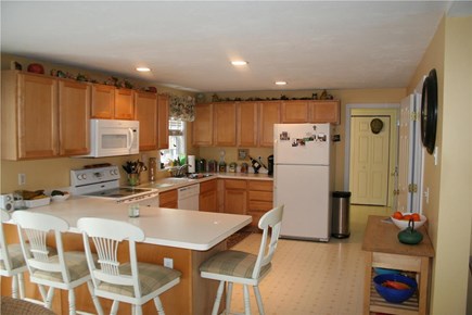 Mashpee Neck Cape Cod vacation rental - Open kitchen with countertop seating.