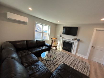 East Falmouth Cape Cod vacation rental - Second family room (2nd fl) gas fireplace, tv and water views