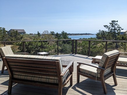 Wellfleet Cape Cod vacation rental - Deck with comfortable furniture and water view.