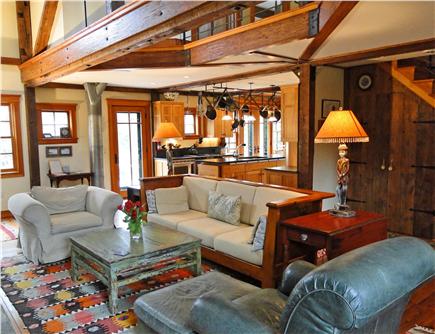East Orleans Cape Cod vacation rental - Living area with stone fireplace, opens to kitchen