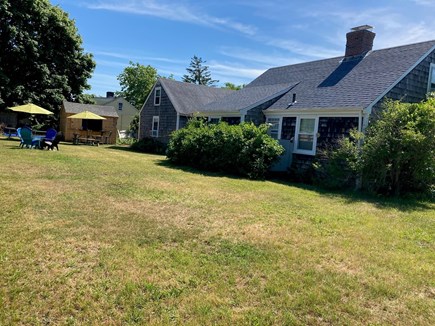 Dennisport Cape Cod vacation rental - Backyard, fire pit, bar, picnic tables, gas grill, &lt;br/&gt;outdoor games