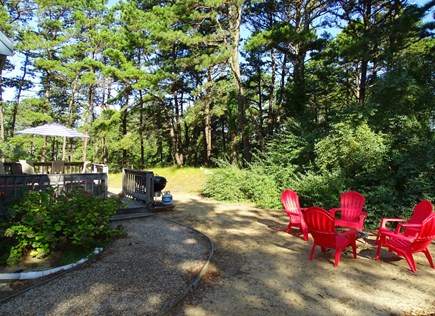 Wellfleet Cape Cod vacation rental - Large backyard with fire pit seating, privacy