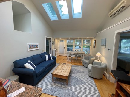 Brewster Cape Cod vacation rental - Skylit living area with A/C, leading to deck with water view