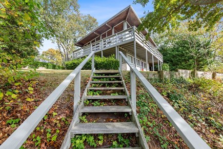 West Dennis Cape Cod vacation rental - Stairs from the pond up to the house