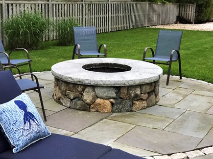 Seconsett Island, Mashpee Cape Cod vacation rental - Fire pit surrounded by chairs