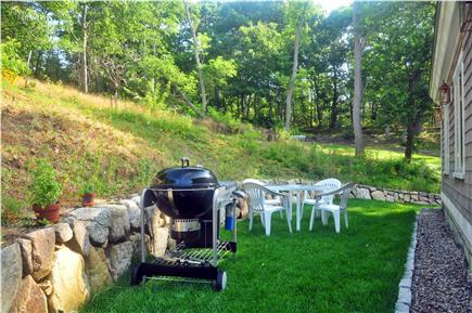 Truro Cape Cod vacation rental - Rear Patio - equipped with a gas grill and dinning for four.