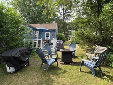 South Yarmouth Cape Cod vacation rental - Gas grill, Blackstone griddle and fire pit. Lots of seating!
