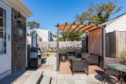Dennis Port Cape Cod vacation rental - Patio off kitchen leading to fenced back yard