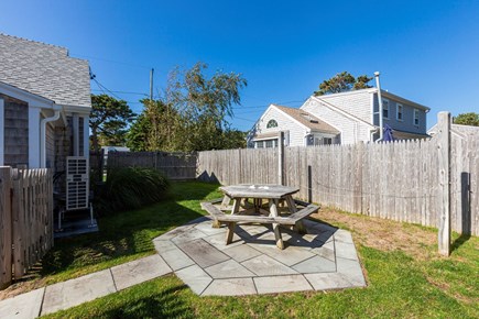 Dennis Port Cape Cod vacation rental - Fenced back yard with picnic table