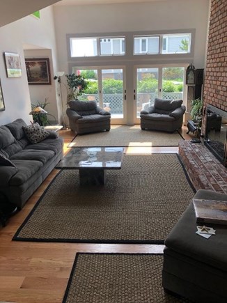 Provincetown Cape Cod vacation rental - Living room, New hardwood floors, Sliders to deck, Wood fireplace