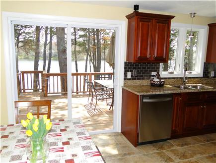 South Yarmouth Cape Cod vacation rental - Dining table sits 6, overlooks deck and freshwater pond.