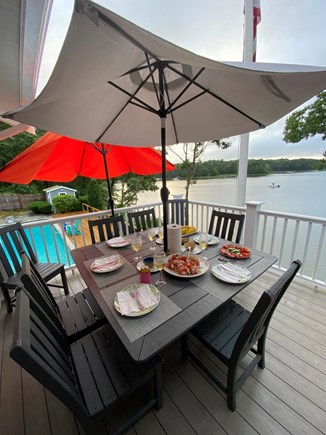 Cotuit Cape Cod vacation rental - A deck with seating for 8 offers views of the bay while dinning