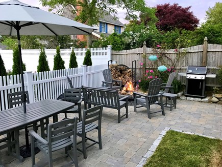 Chatham downtown village Cape Cod vacation rental - Private patio w/ dining, firepit (wood incl), grill & shower