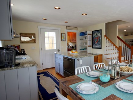 Chatham downtown village Cape Cod vacation rental - Updated appliances & granite, open shelving filled with dishware.