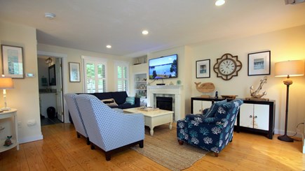 Chatham downtown village Cape Cod vacation rental - Open living room w/ fireplace and 55 inch TV (cable and Wifi)