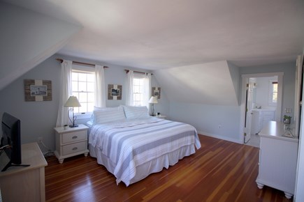 Chatham downtown village Cape Cod vacation rental - Spacious primary bedroom with king bed, en suite bath, TV & cable