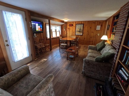 South Chatham Cape Cod vacation rental - A comfortable living/dining room with a water peak, TV and wifi.