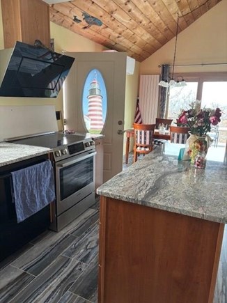 North Eastham Cape Cod vacation rental - Entrance with open kitchen and dining area