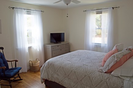 West Dennis Cape Cod vacation rental - Master bedroom with half bath and TV
