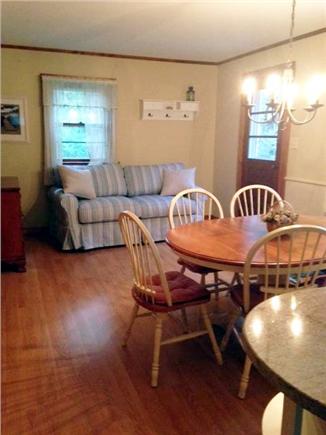 East Orleans Cape Cod vacation rental - Open kitchen with dining area and sofa