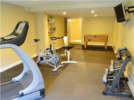 Barnstable Cape Cod vacation rental - Downstairs exercise room with foosball, walk out to back yard