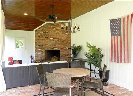 Barnstable Cape Cod vacation rental - Outdoor living room with fireplace