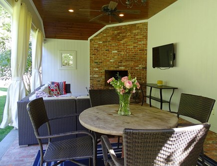 Barnstable Cape Cod vacation rental - Outdoor living room with fireplace and TV