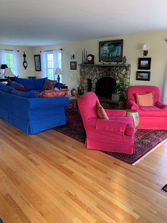 Sandwich Cape Cod vacation rental - Living room with fireplace. Chairs swivel for room or water view.