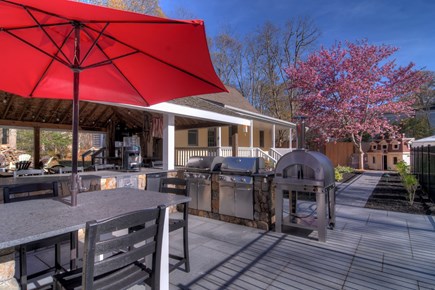 Eastham Cape Cod vacation rental - Outdoor kitchen with webber grills and new gas pizza oven.