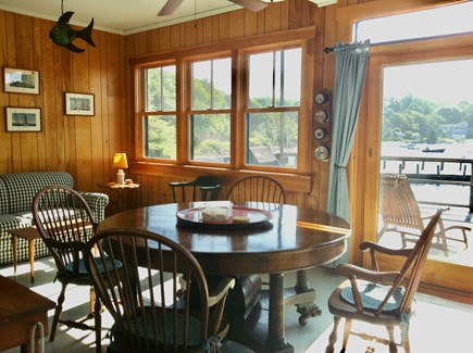 Woods Hole Cape Cod vacation rental - Sunroom with dining table and access to deck