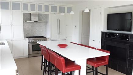 Provincetown Cape Cod vacation rental - Sleek and modern kitchen with TV & fireplace